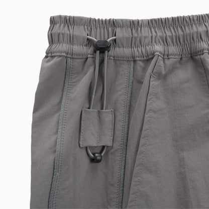 PUMA WASHER WOVEN LONG PANTS W（PROJECT PLUS） FLAT MEDIUM GRAY